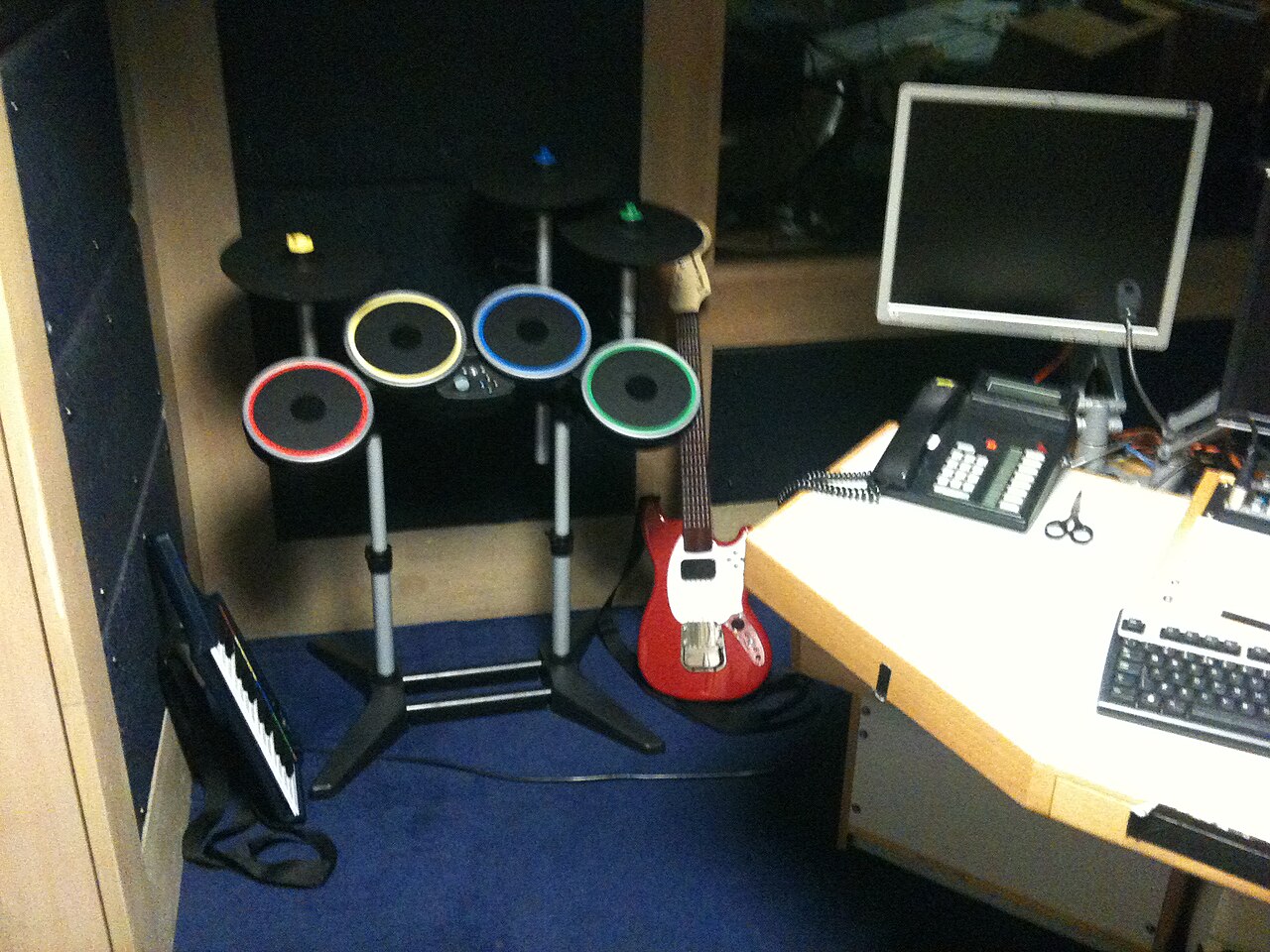 Illustrative Rock Band instrument controllers photo; not a photo of New Game Plus Gaming Center