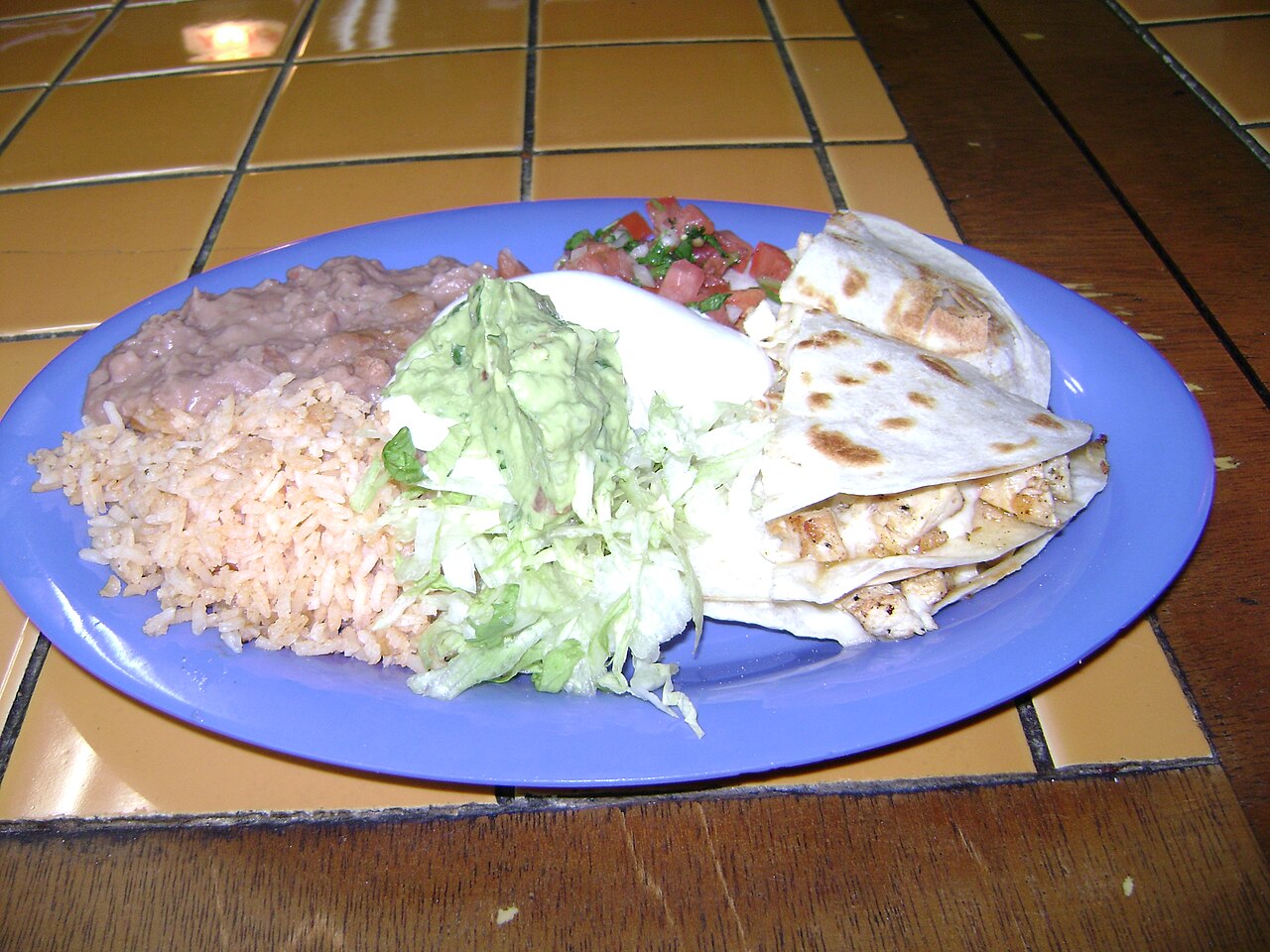 Illustrative chicken quesadilla photo; not a photo of Taqueria Mexico