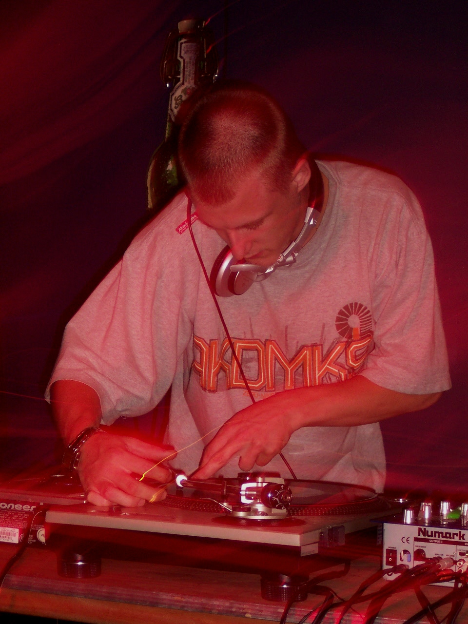 Illustrative DJ working a music mixer in a club photo — not taken at Kocky's Bar & Grill