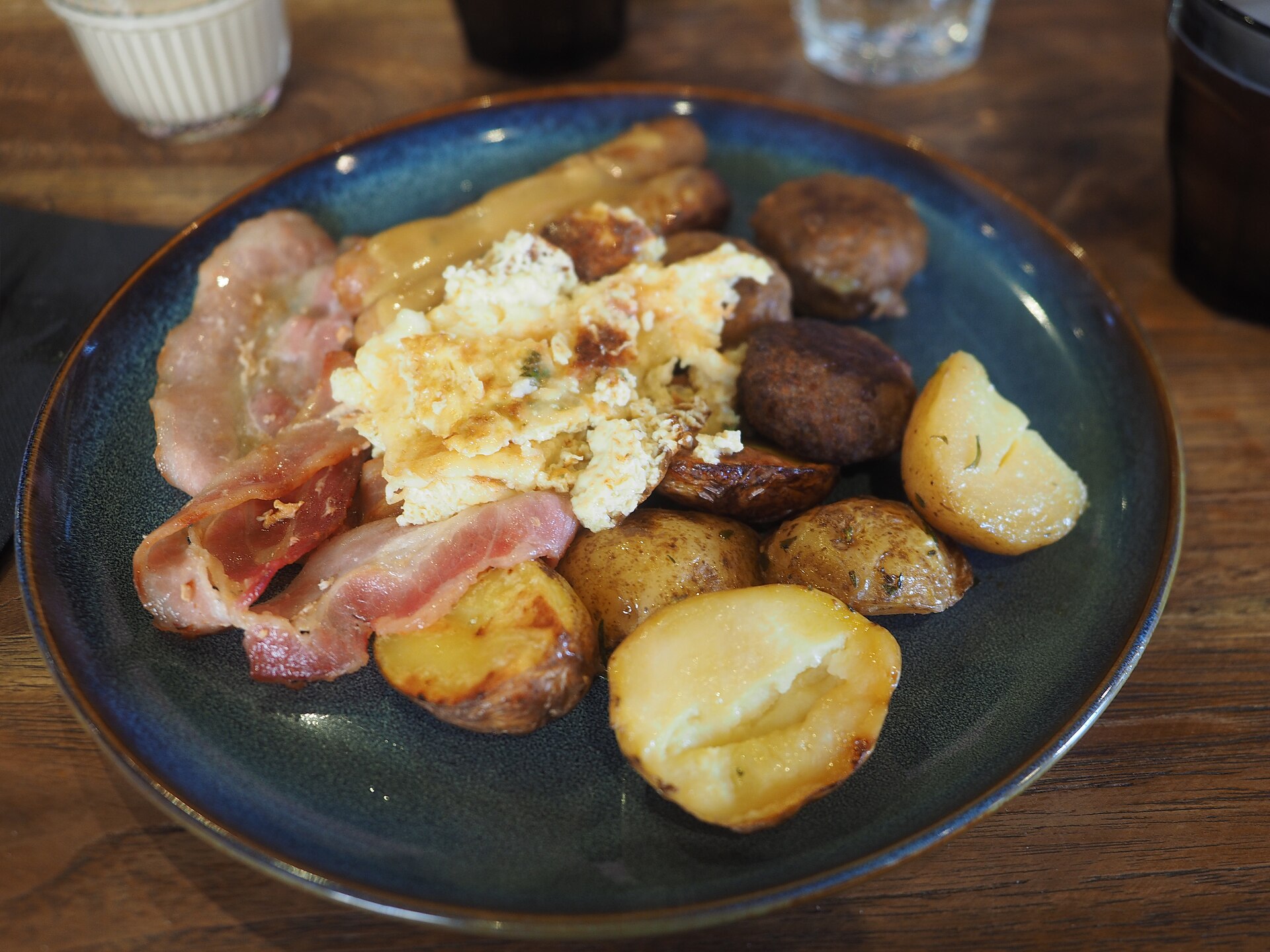 Illustrative photograph of brunch breakfast plate with eggs bacon and potatoes; not a photograph of Chevys Fresh Mex - Sacramento