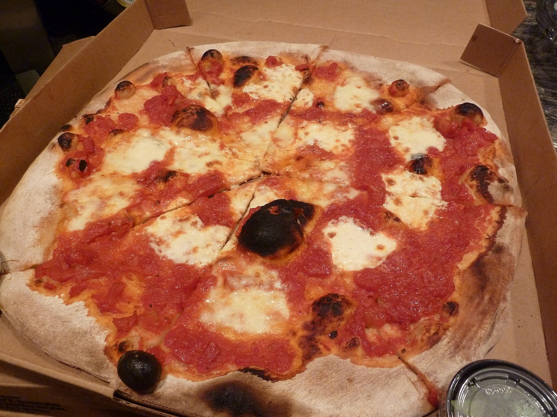 Illustrative photograph of cheese pizza with tomato sauce; not a photograph of Pintworks Brewpub (Touchstone)