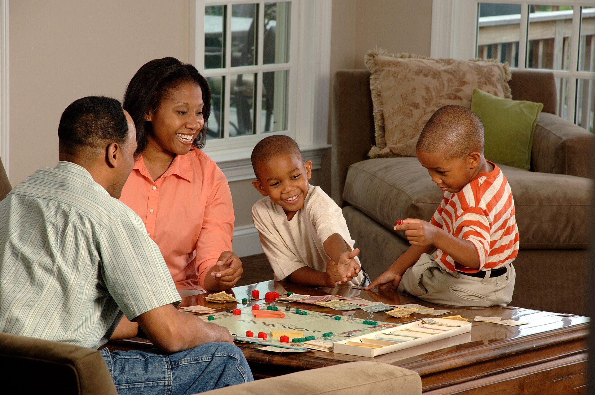 Illustrative photograph of group of family playing a board game for illustrative trivia; not a photograph of King Cong Brewing Co.