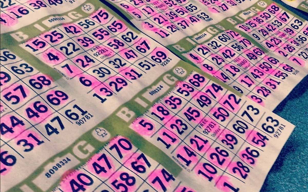 Illustrative photograph of colorful bingo game sheets laid on a table; not a photograph taken at Brick West Brewing Co.
