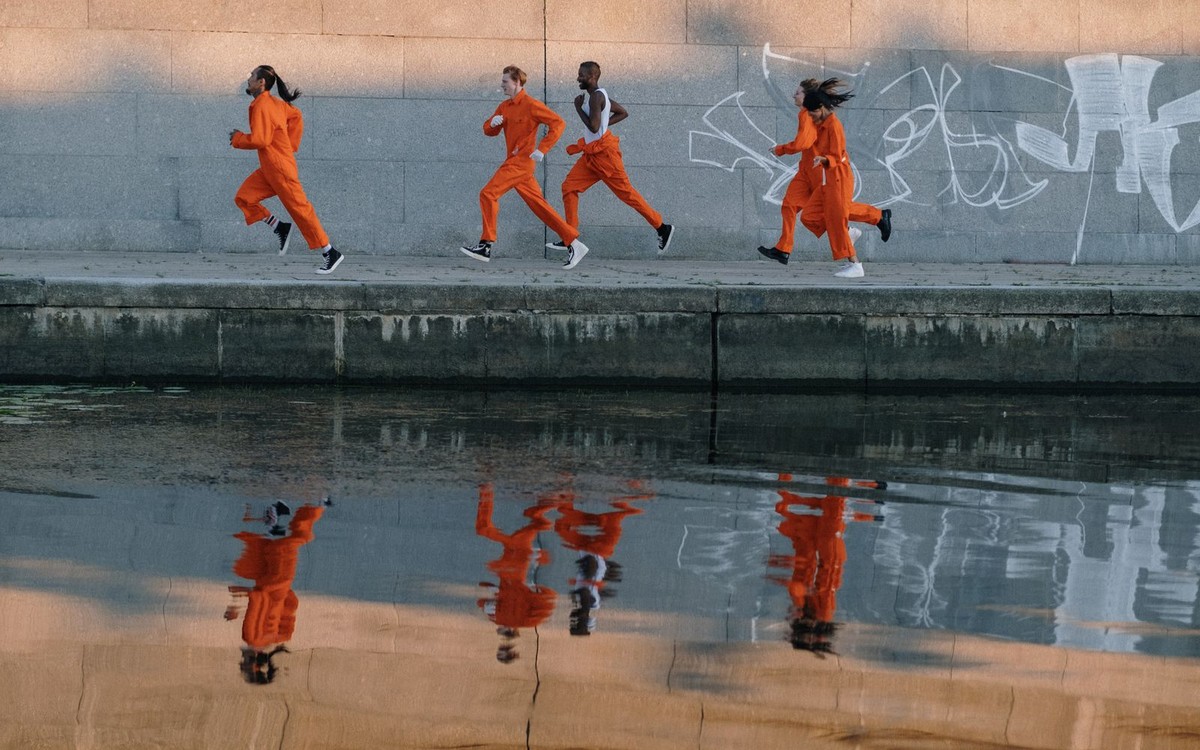Illustrative photo of group of runners jogging together in an urban setting; not a photo of Uprise Brewing Co.